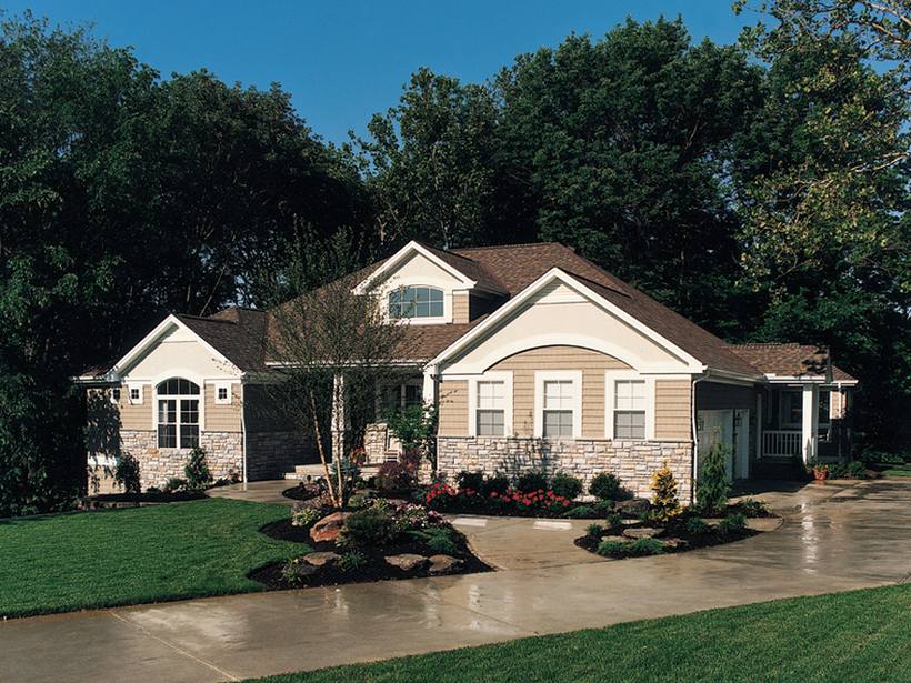 Newly built home with aluminum windows and landscaped entry